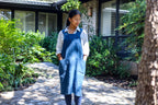 Model wearing the Blue cross-back linen apron