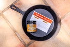 Overhead view of a cast iron skillet holding the recipe card and Original chorizo seasoning
